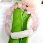 This meticulously crafted bracelet features genuine Rose Quartz beads