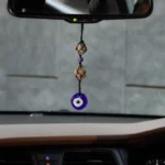 Shield Your Space and attract prosperity with Our Nazar Rakshak Hanging Charm with Evil Eye and Pyrite stone.