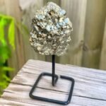 Row pyrite cluster on metal stand